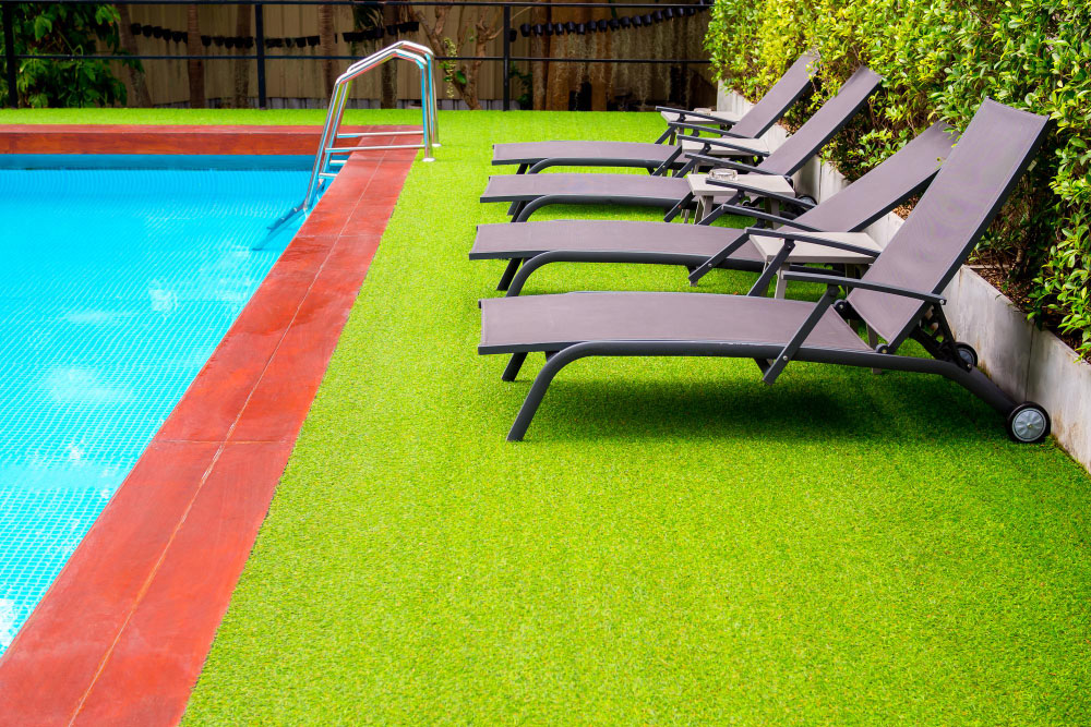 Why Installing Synthetic Grass Keeps Your Pool Cleaner