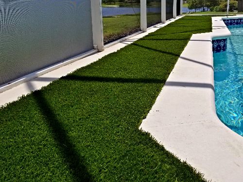 Artificial turf around swimming pool