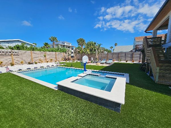 Artificial grass lawn around the pool area